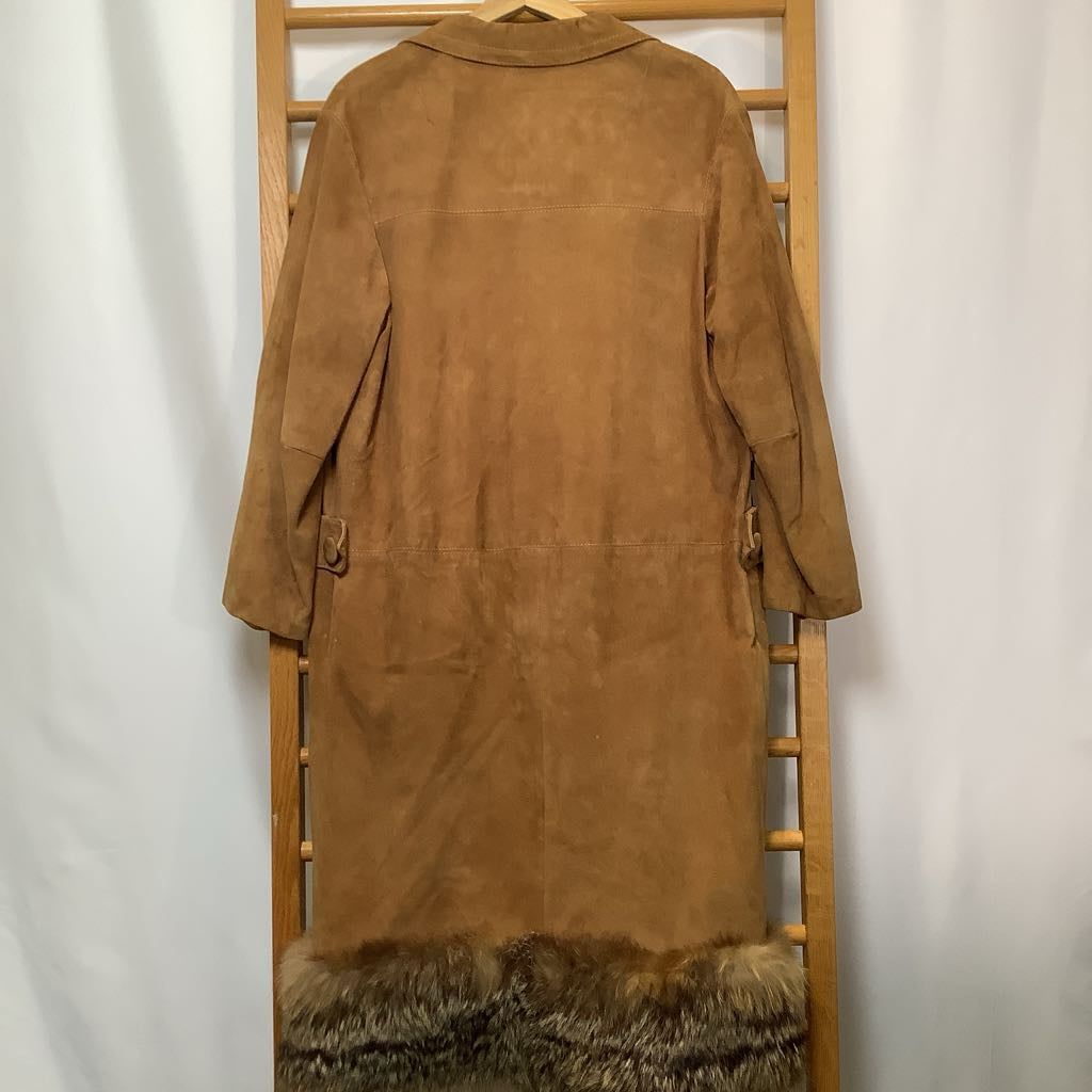 Brown suede coat with fur trim hanging on a wooden rack against a white background