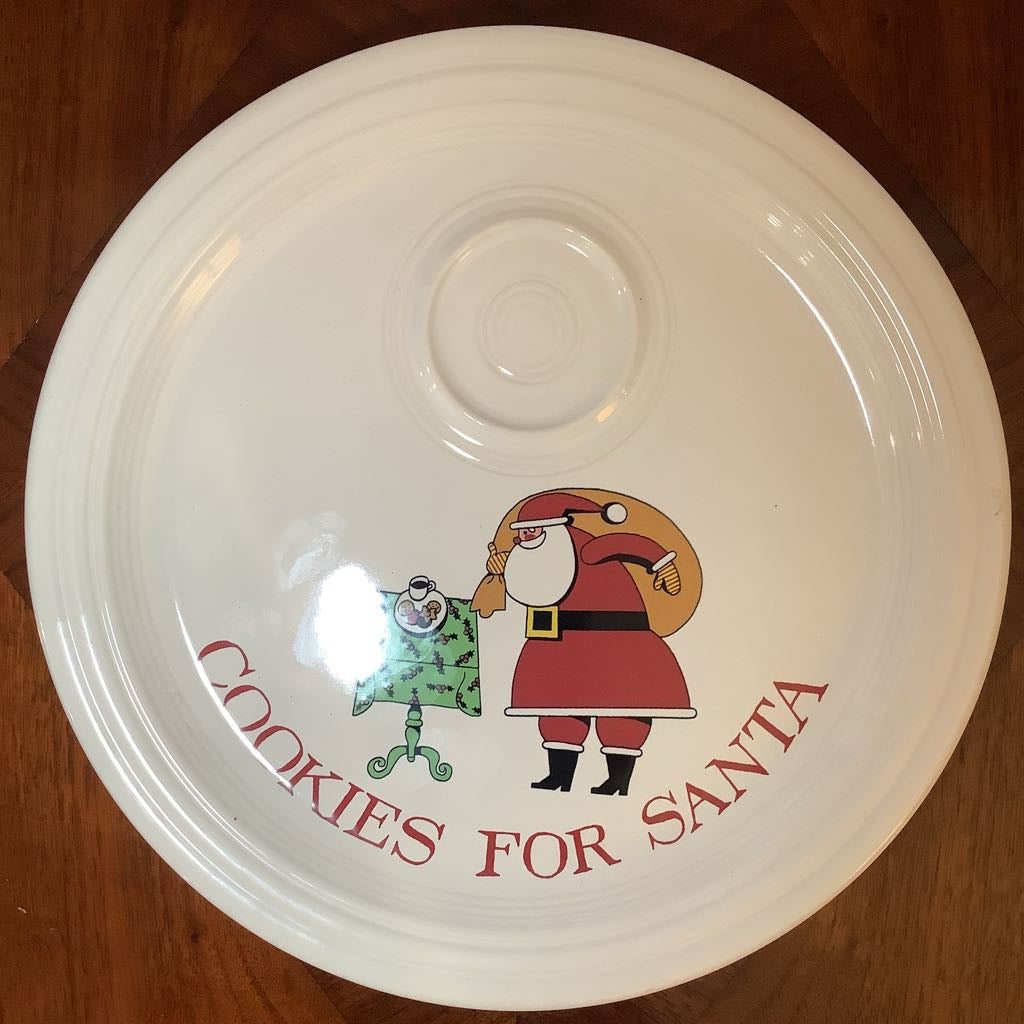 White ceramic bowl with 'Cookies for Santa' design featuring a green table and Santa Claus on a wooden surface.