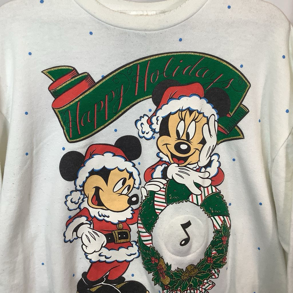 Christmas-themed sweatshirt with cartoon characters and 'Happy Holidays' text on a white background.