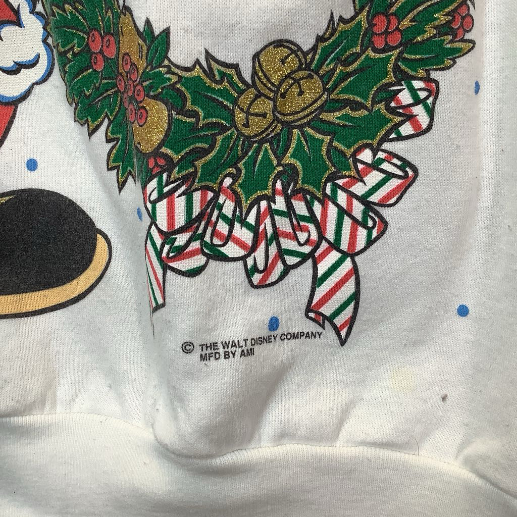 Close-up of a Christmas-themed design on a white background with 'The Walt Disney Company' logo.