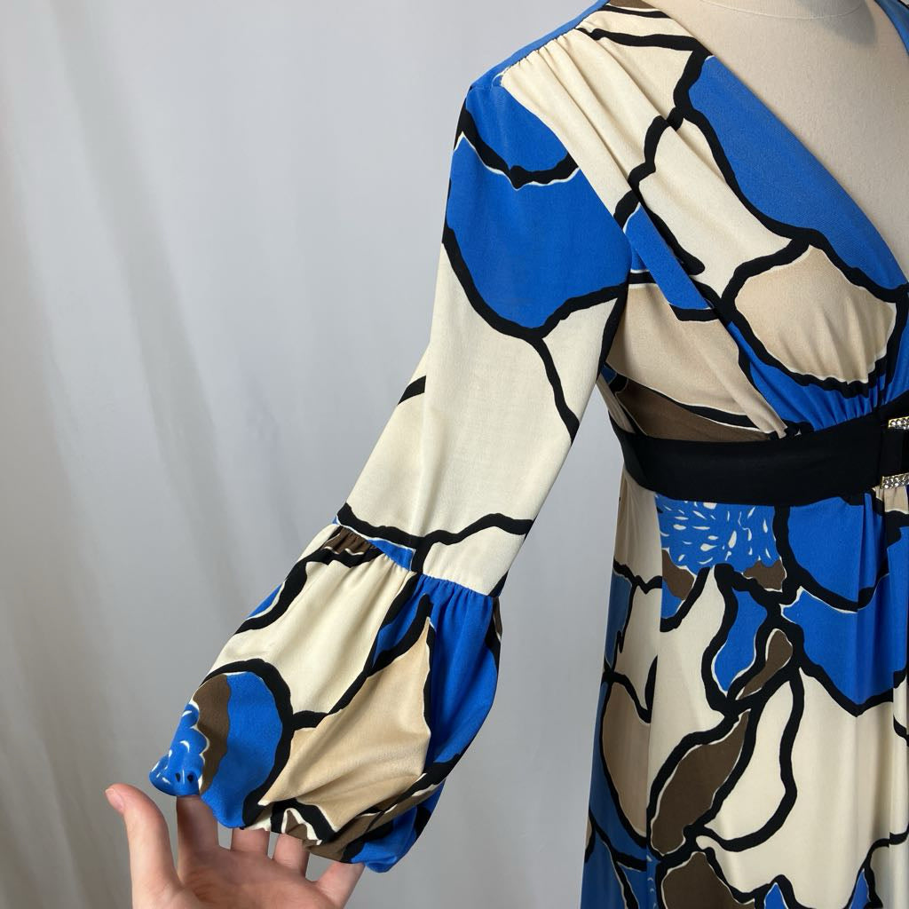 Patterned dress with blue and beige design on a plain background
