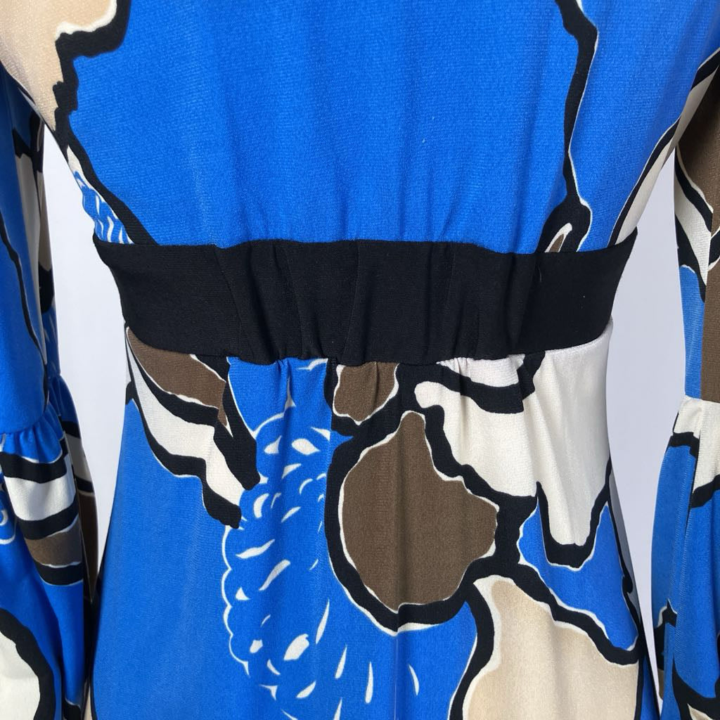Close-up of a blue dress with abstract floral pattern on a white background