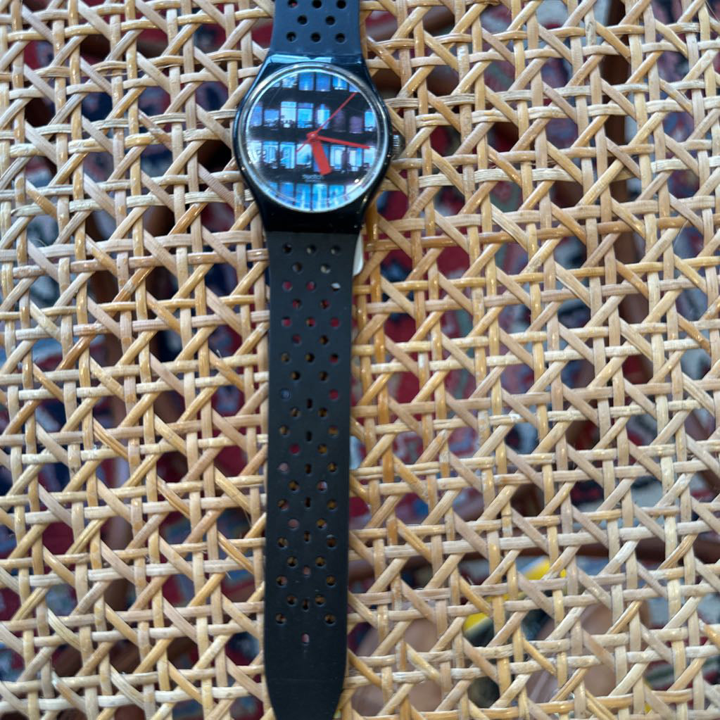 Wristwatch with a unique face on a textured woven surface