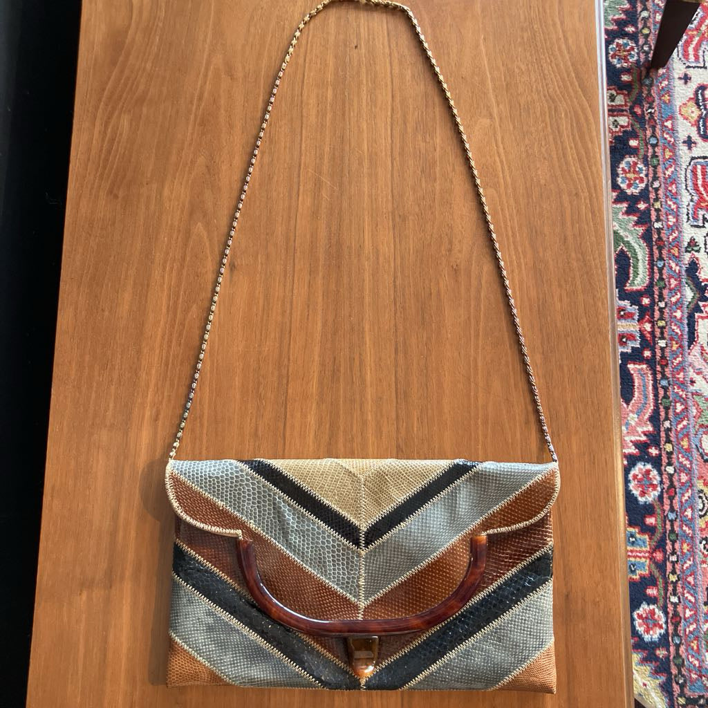 Handbag with geometric pattern on a wooden surface