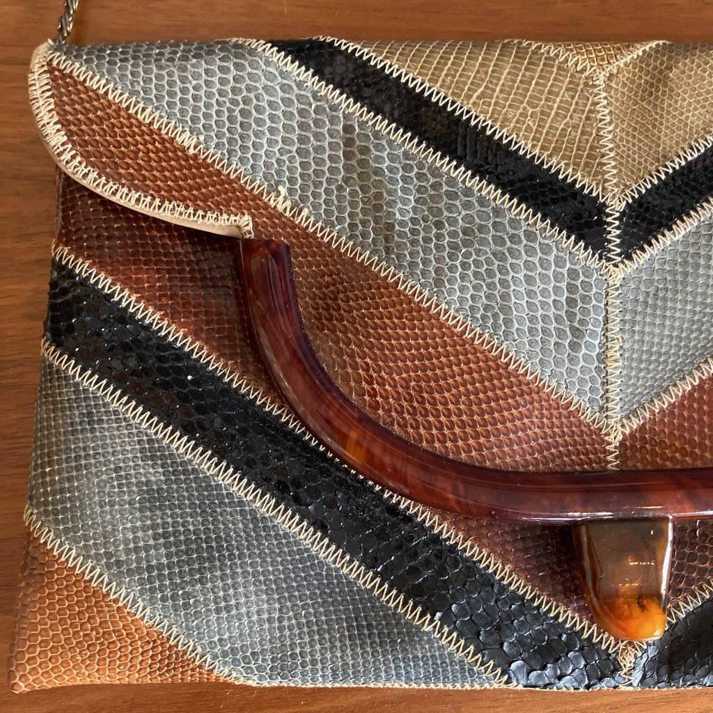 Close-up of a patterned handbag with a wooden surface background