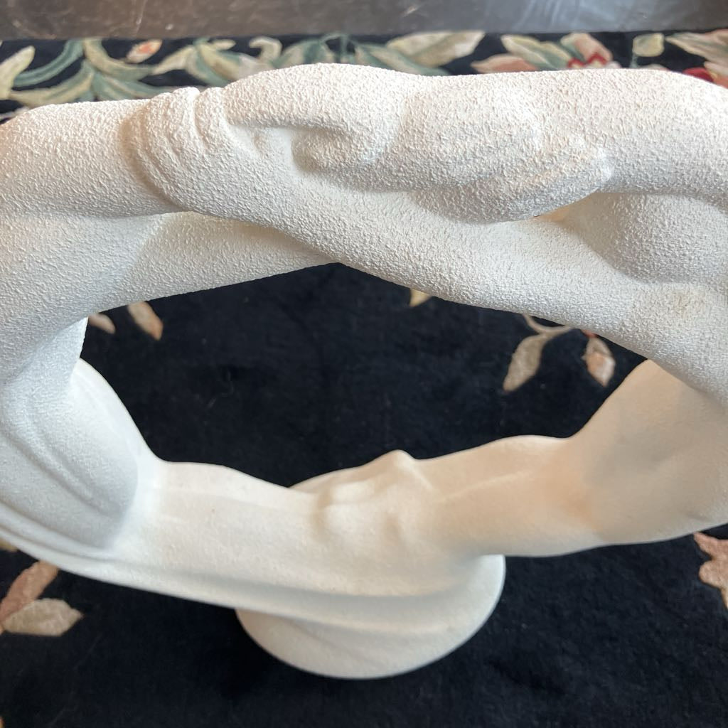 Close-up of a textured white object on a floral-patterned surface