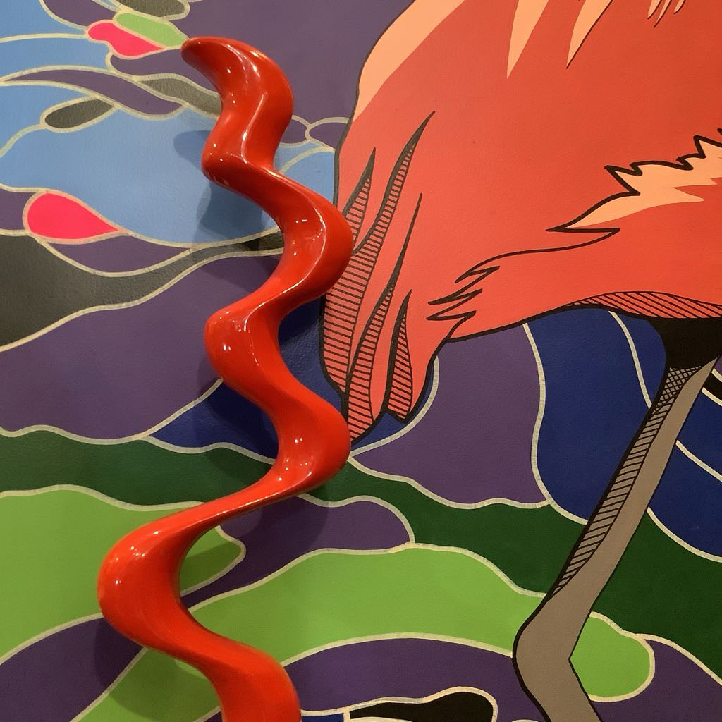 Abstract artwork with wavy red line and colorful background