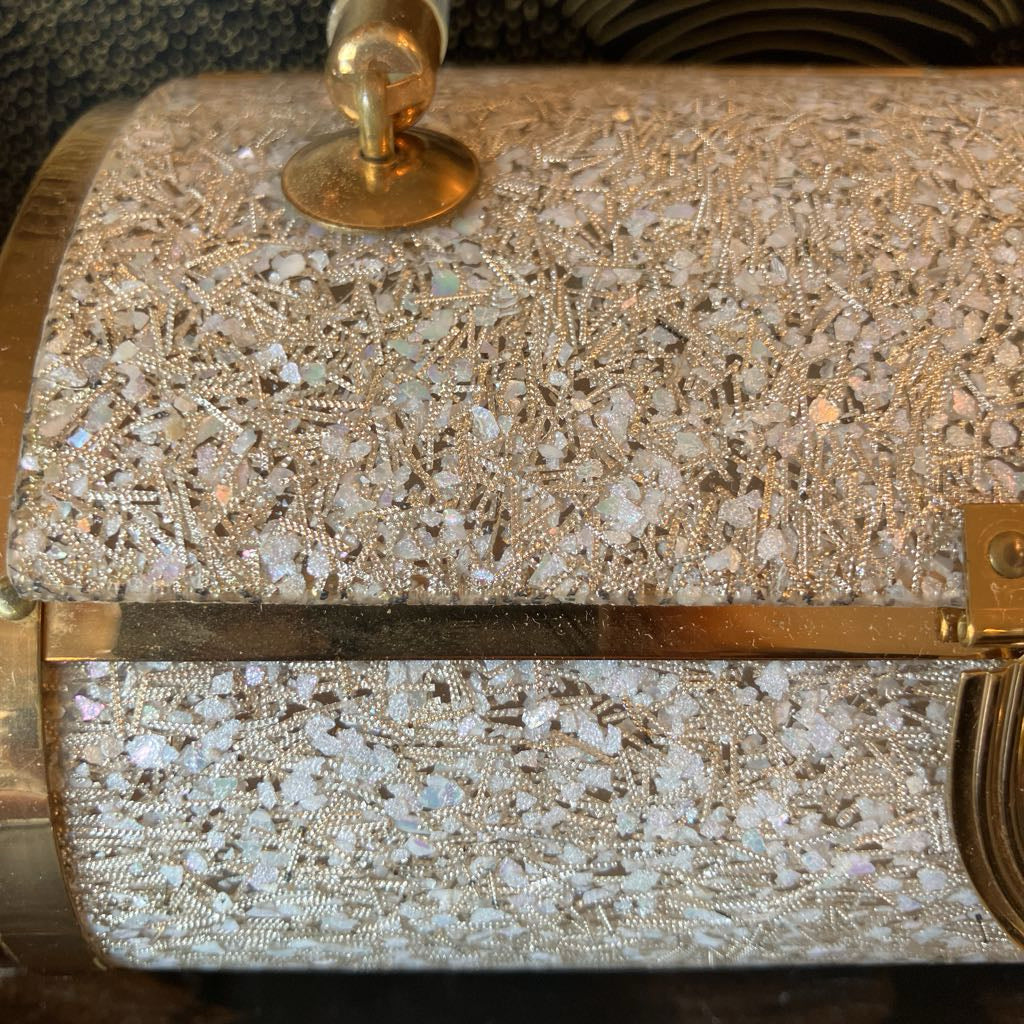 Close-up of a confetti pattern on lucite bag. 