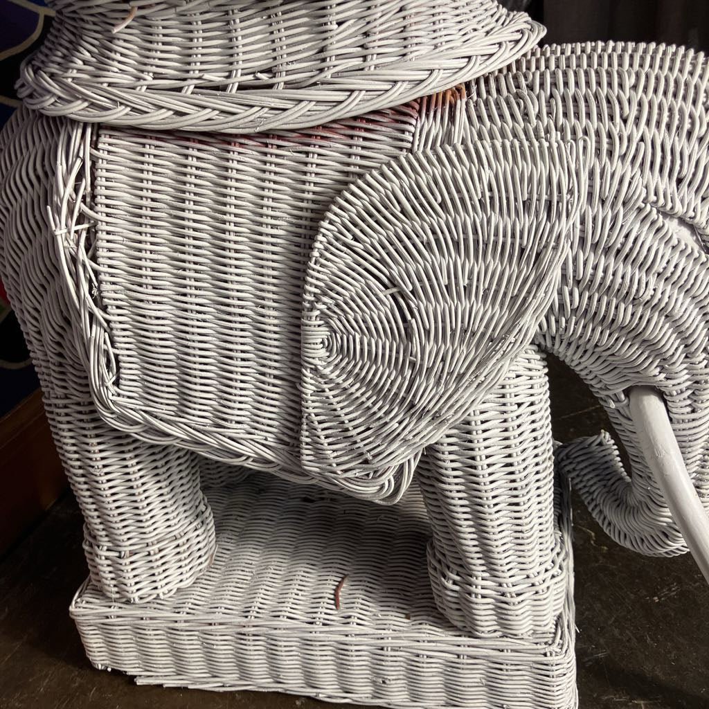 Wicker elephant-shaped side table with a woven design.