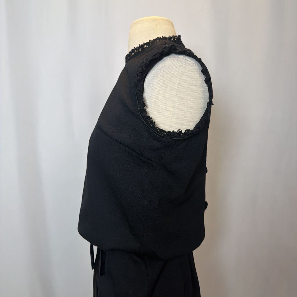 Black garment on a mannequin with a white background