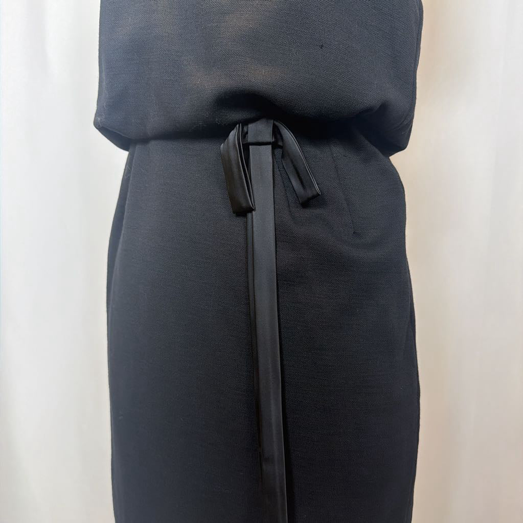 Black dress with a belt on a white background