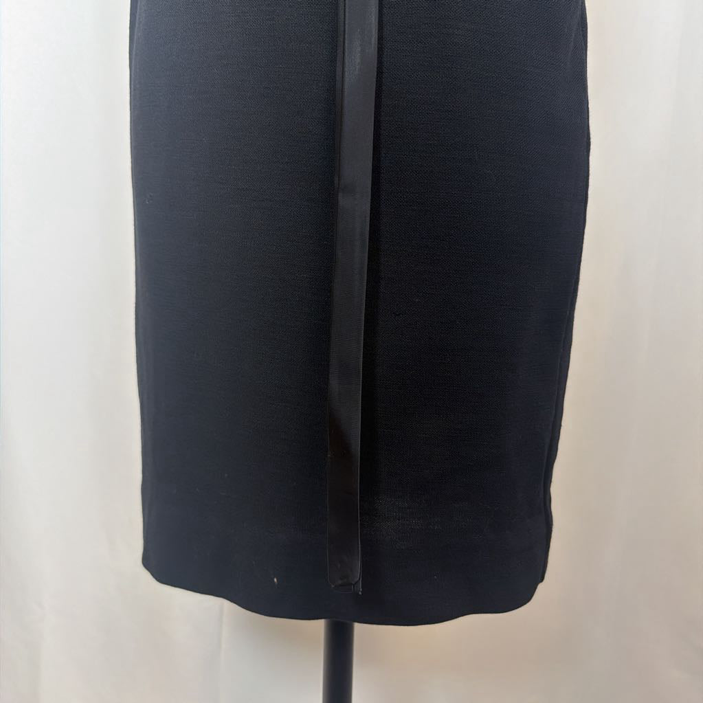 Black dress on a mannequin against a white background