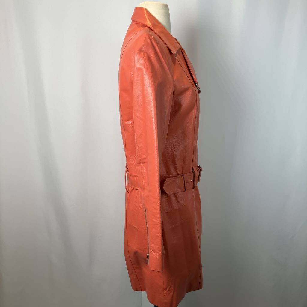 side view of orange jacket on mannequin