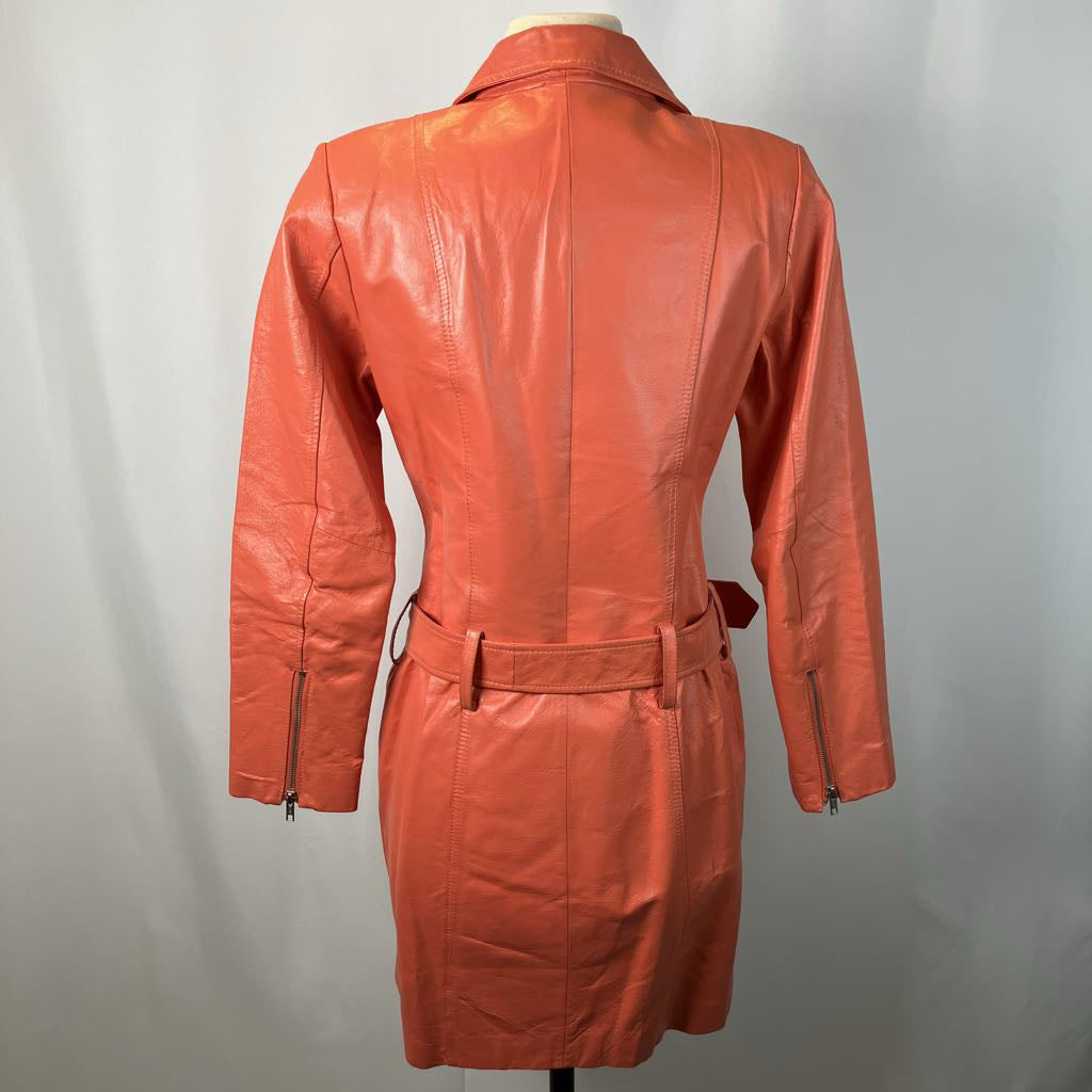 back of orange jacket on mannequin against a white background