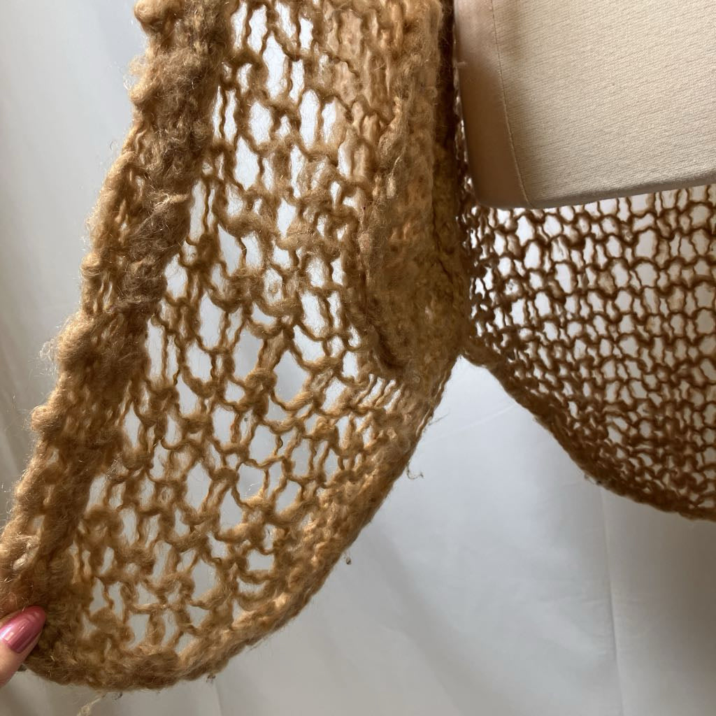 Close-up of a textured brown fabric with a white background