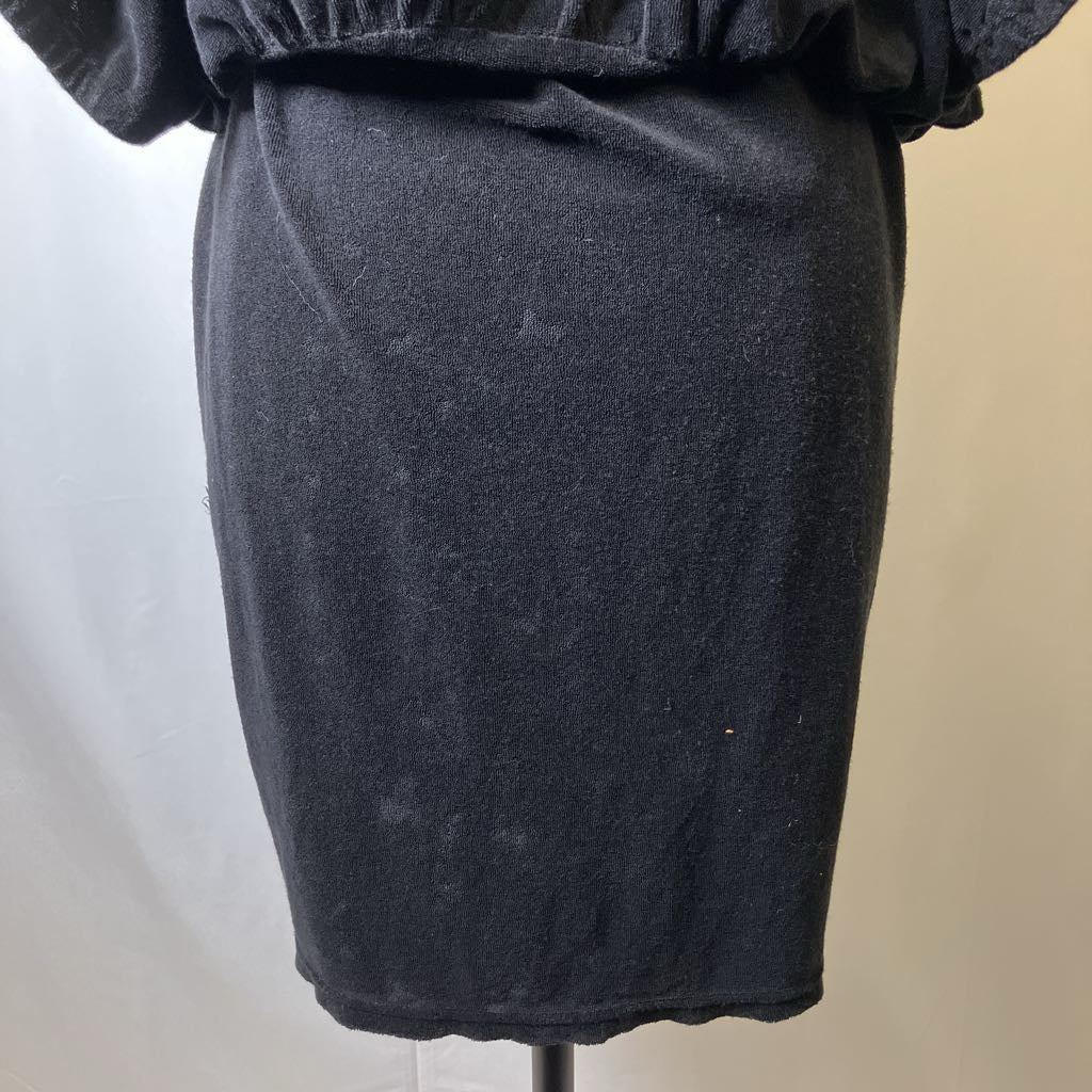 Black skirt on a mannequin against a neutral background