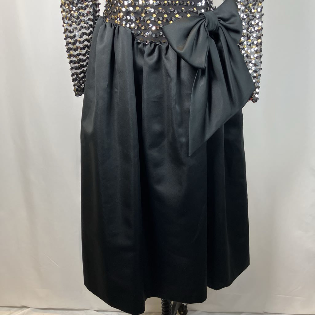 Black skirt with a large bow on a plain background