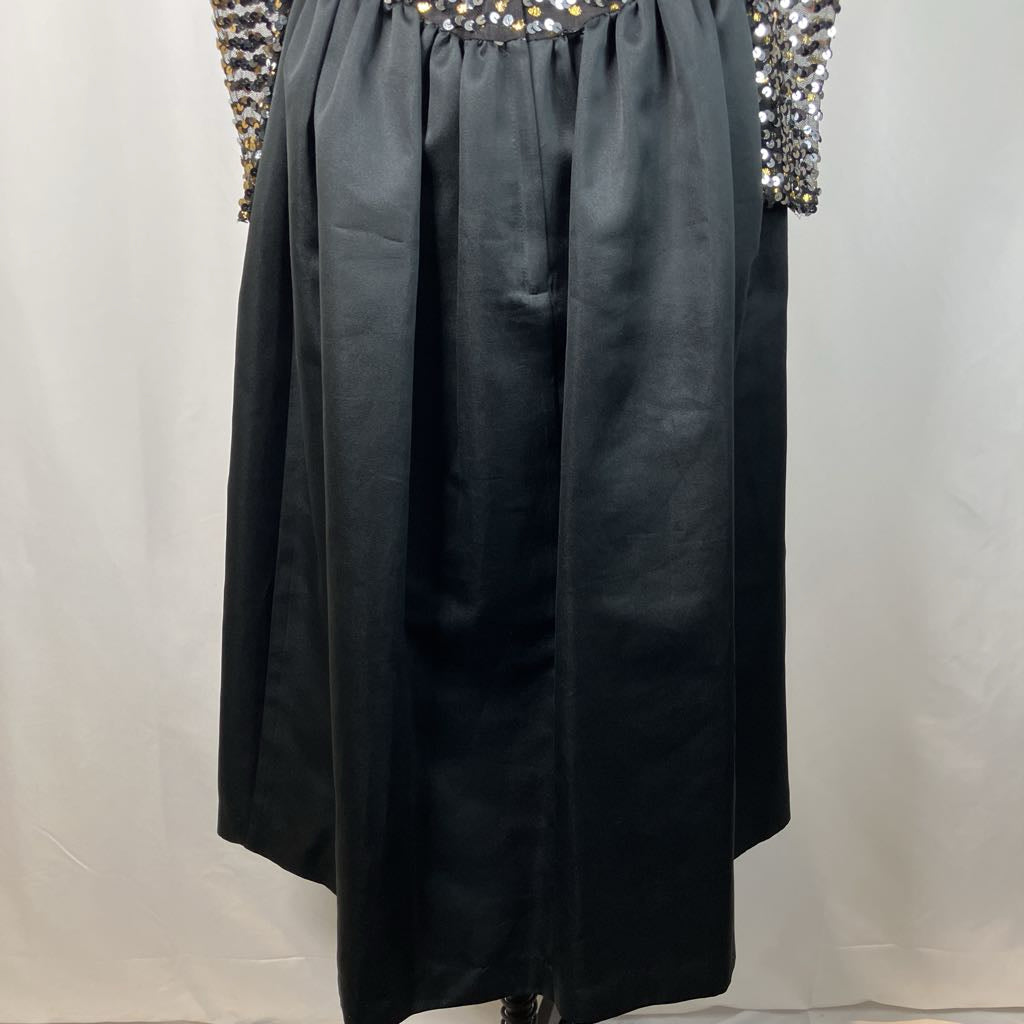 Black dress with embellished shoulders on a white background