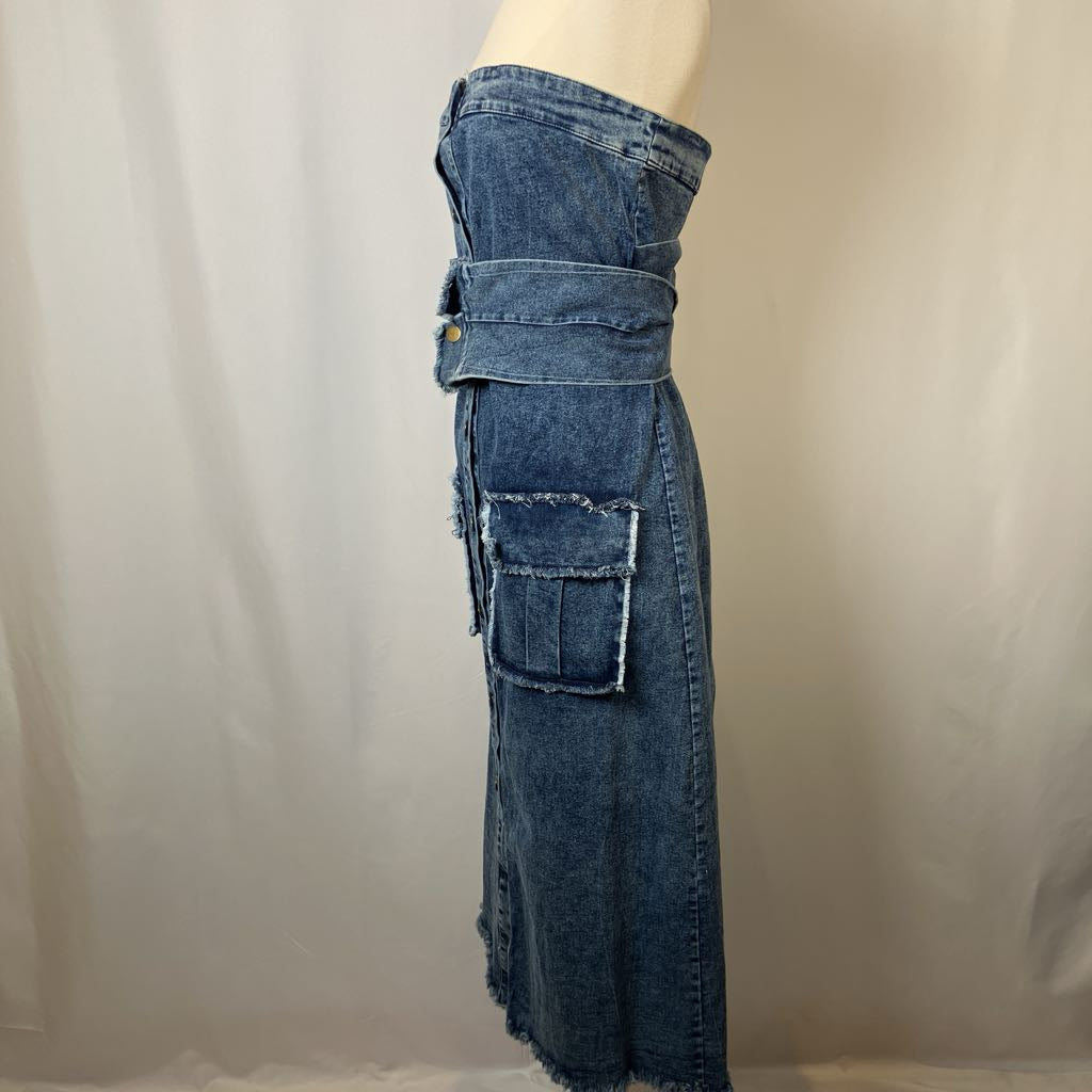 Blue denim dress with cargo pocket design on a mannequin against a plain background