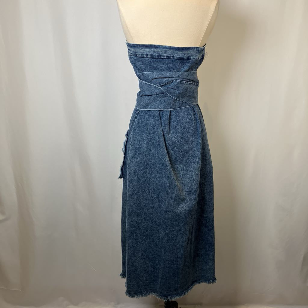 Blue denim dress on a mannequin against a plain background