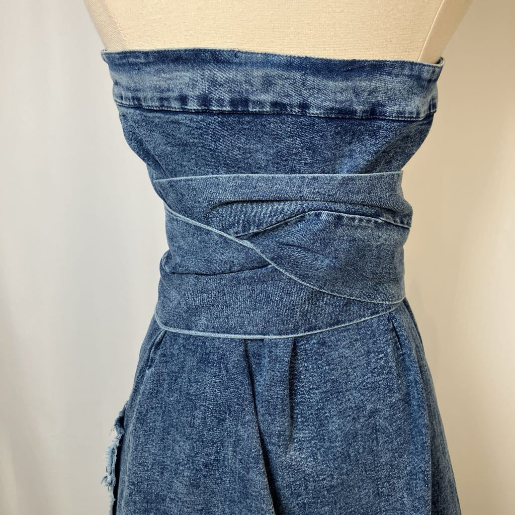 Blue denim dress on a mannequin against a plain background