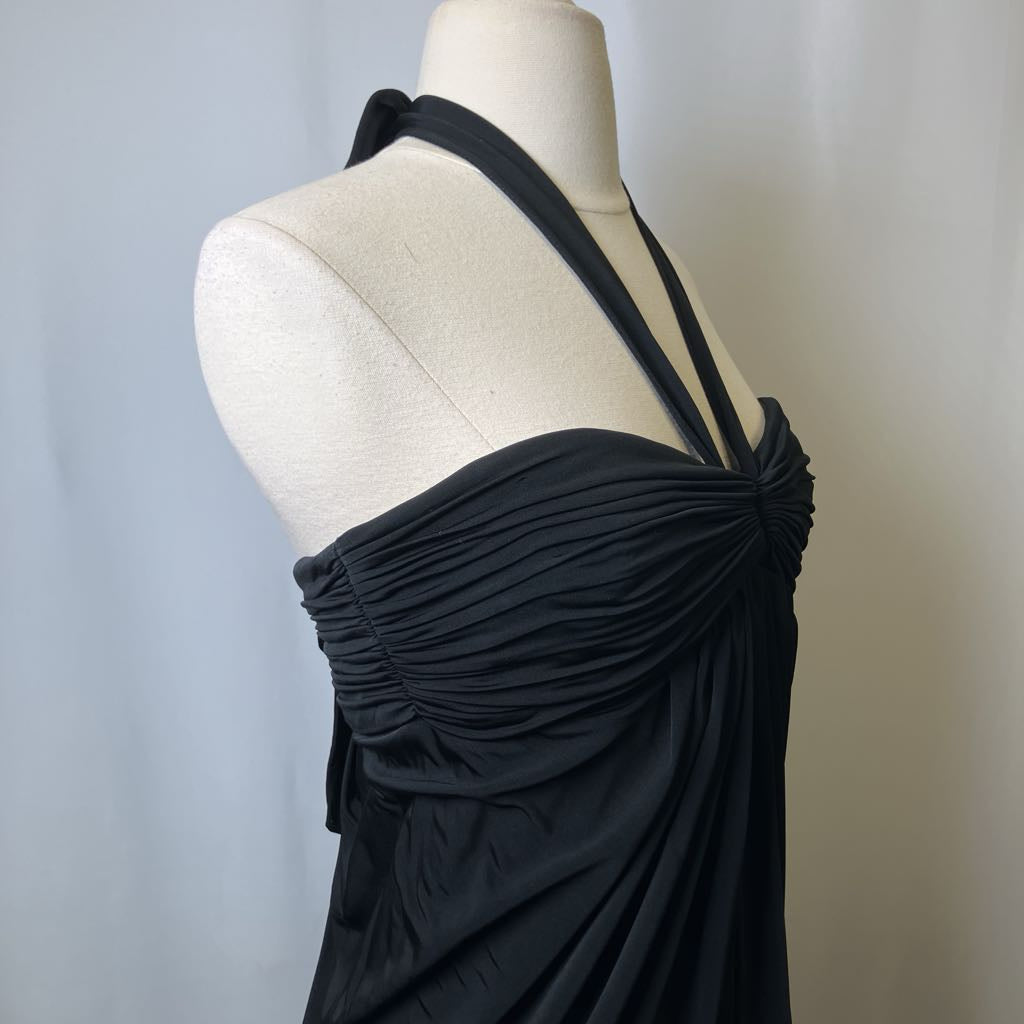Black halter top on a mannequin against a neutral background