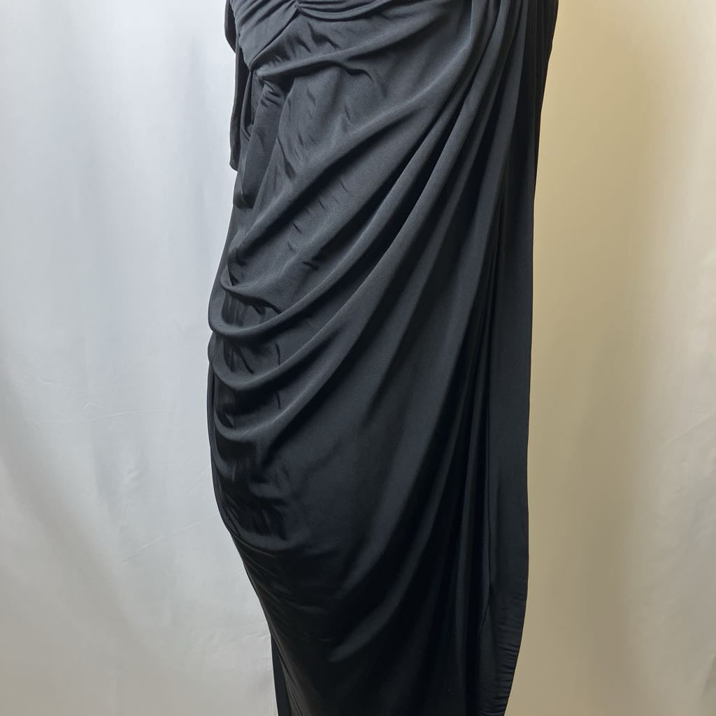 Black draped dress on a white background