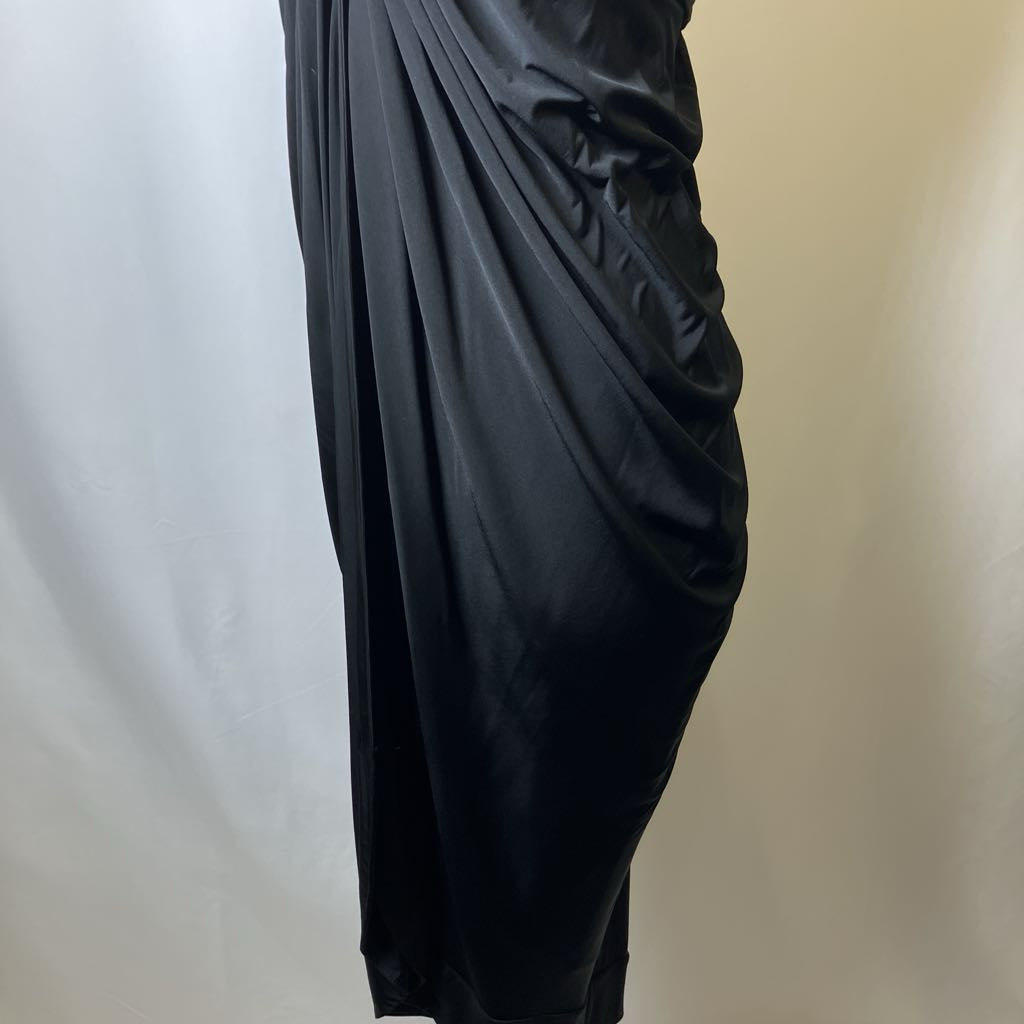 Black draped fabric on a plain background