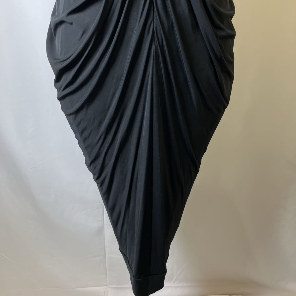 Black draped fabric on a neutral background