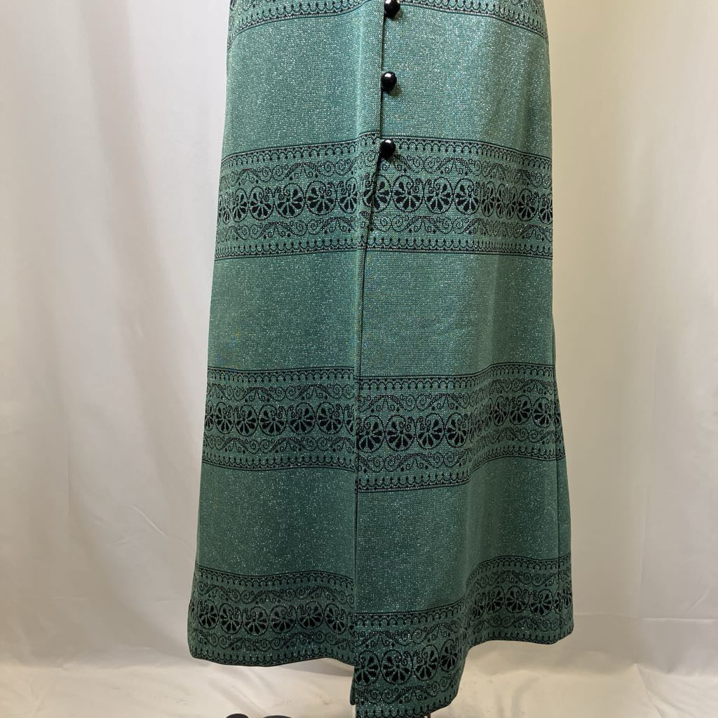 Green skirt with black lace details on a white background