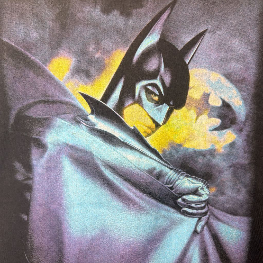 Animated character in a cape with a moonlit sky background