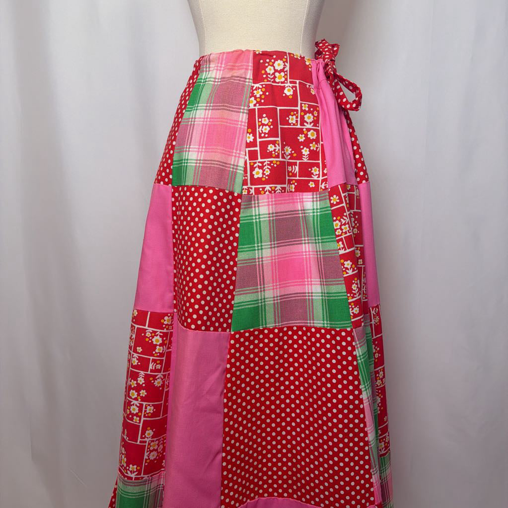 Colorful patchwork skirt on a mannequin against a white background