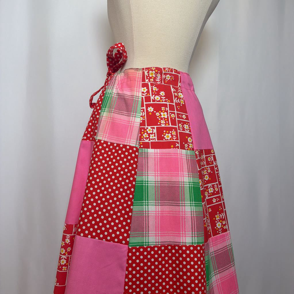 Colorful patchwork skirt on a mannequin against a white background