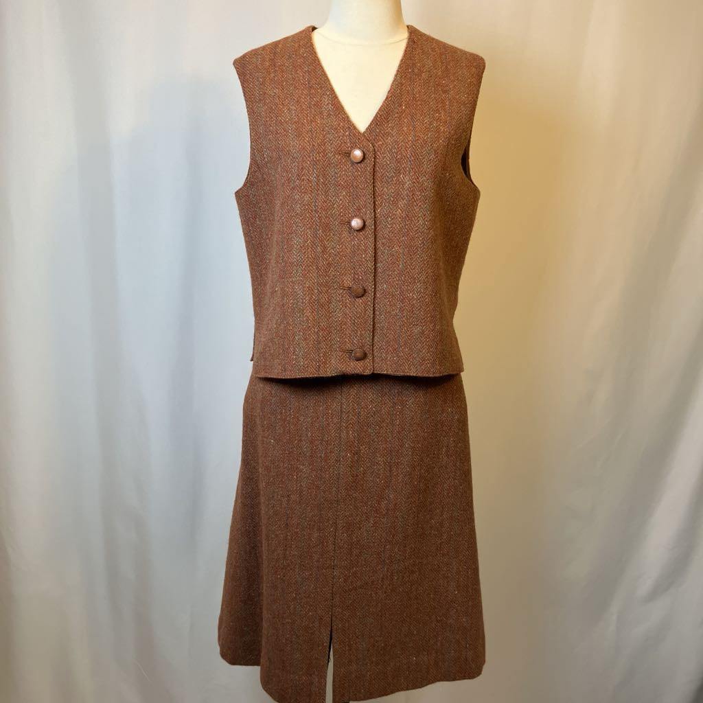 Brown skirt suit on a mannequin against a plain background