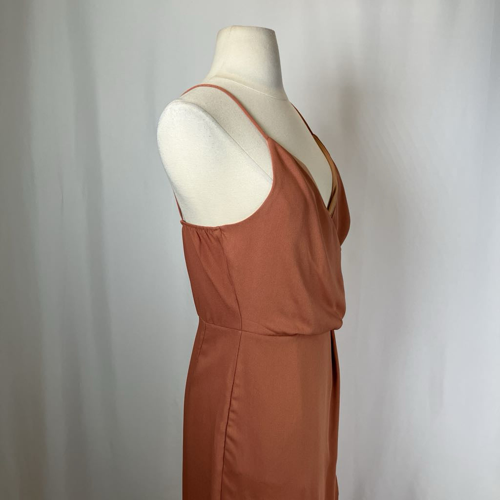 Brown dress on a mannequin against a plain background