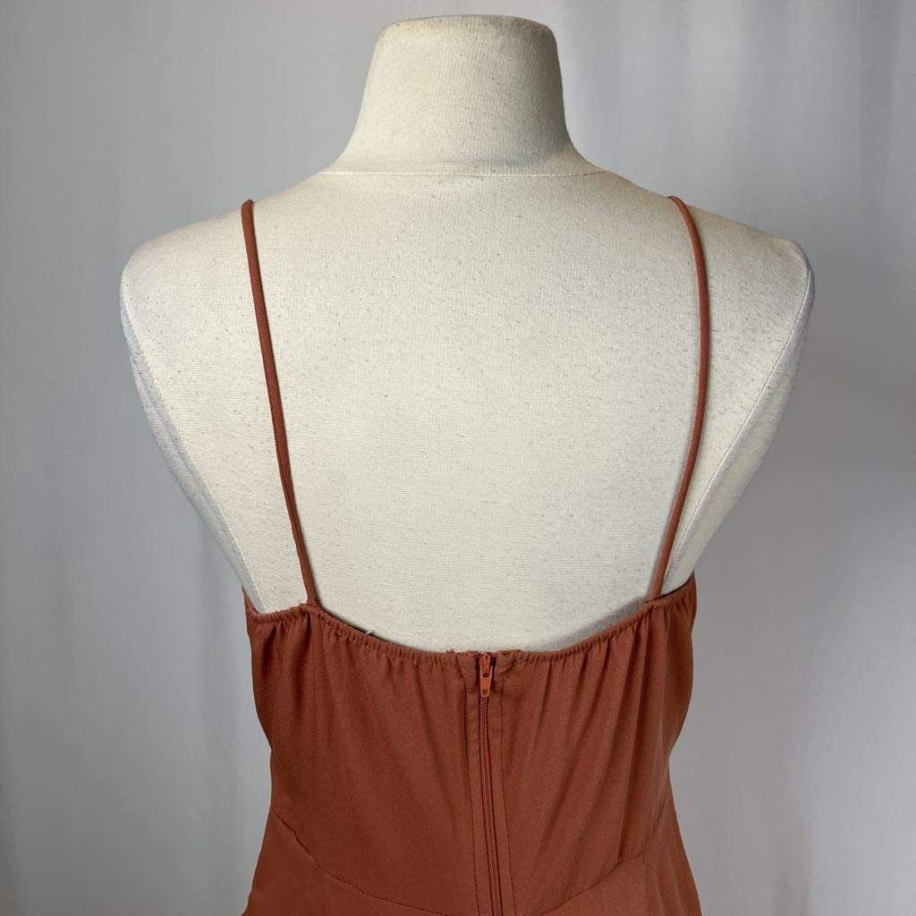 Brown dress on a mannequin with a plain background
