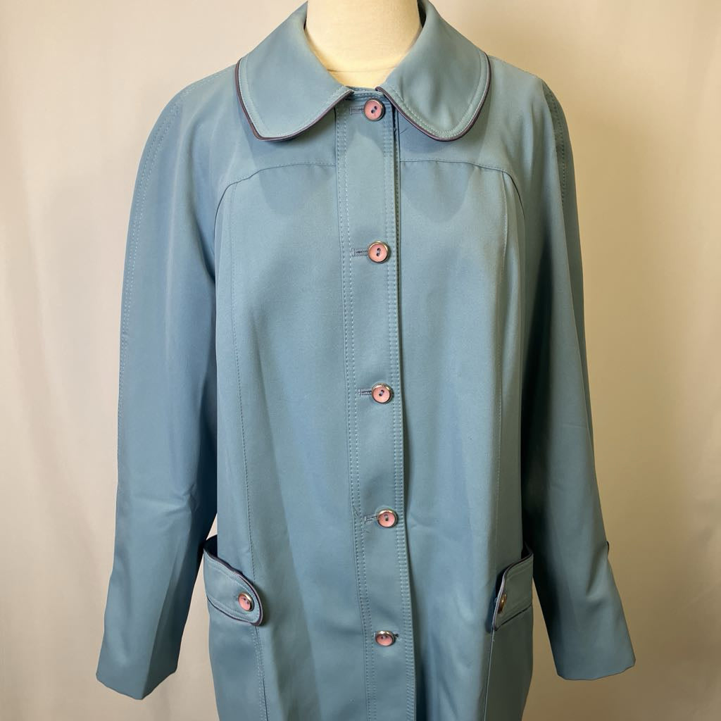 Blue coat with a collar on a beige background