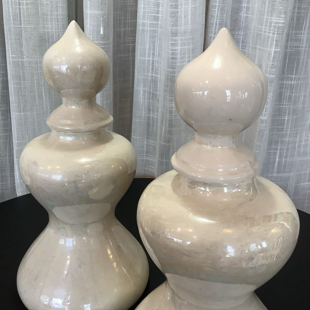 Close up of two ceramic canisters 