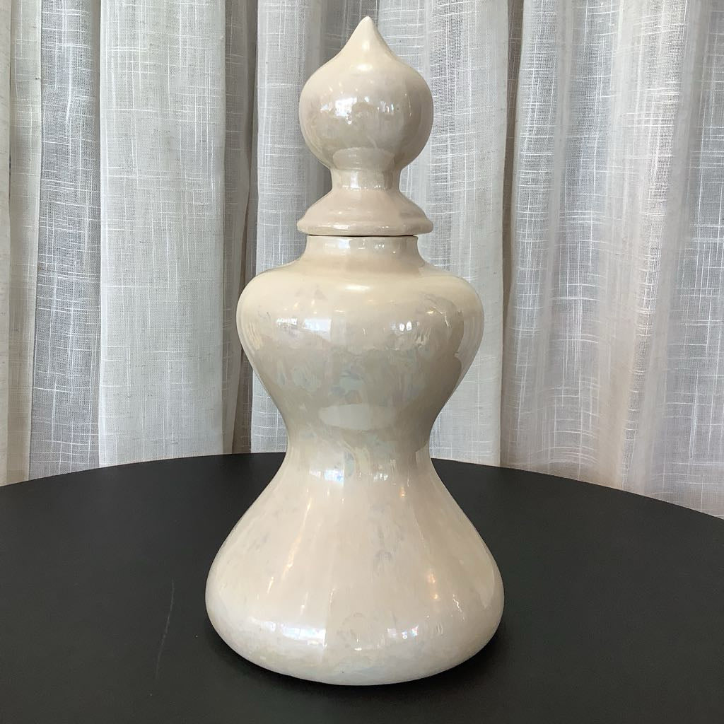 singular ceramic canister with iridescent, white glaze 