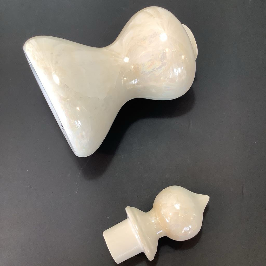 Canister on its side with lid detached 