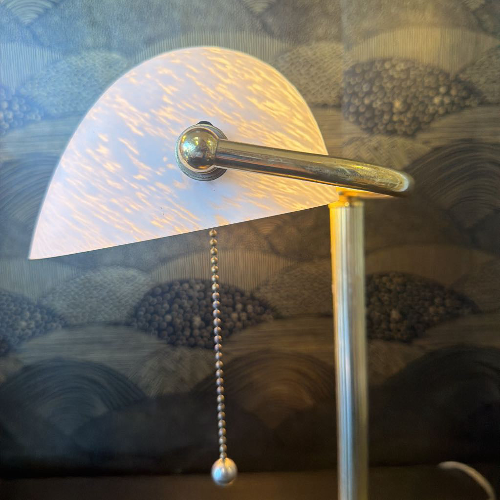 Table lamp with a textured lampshade on a patterned surface