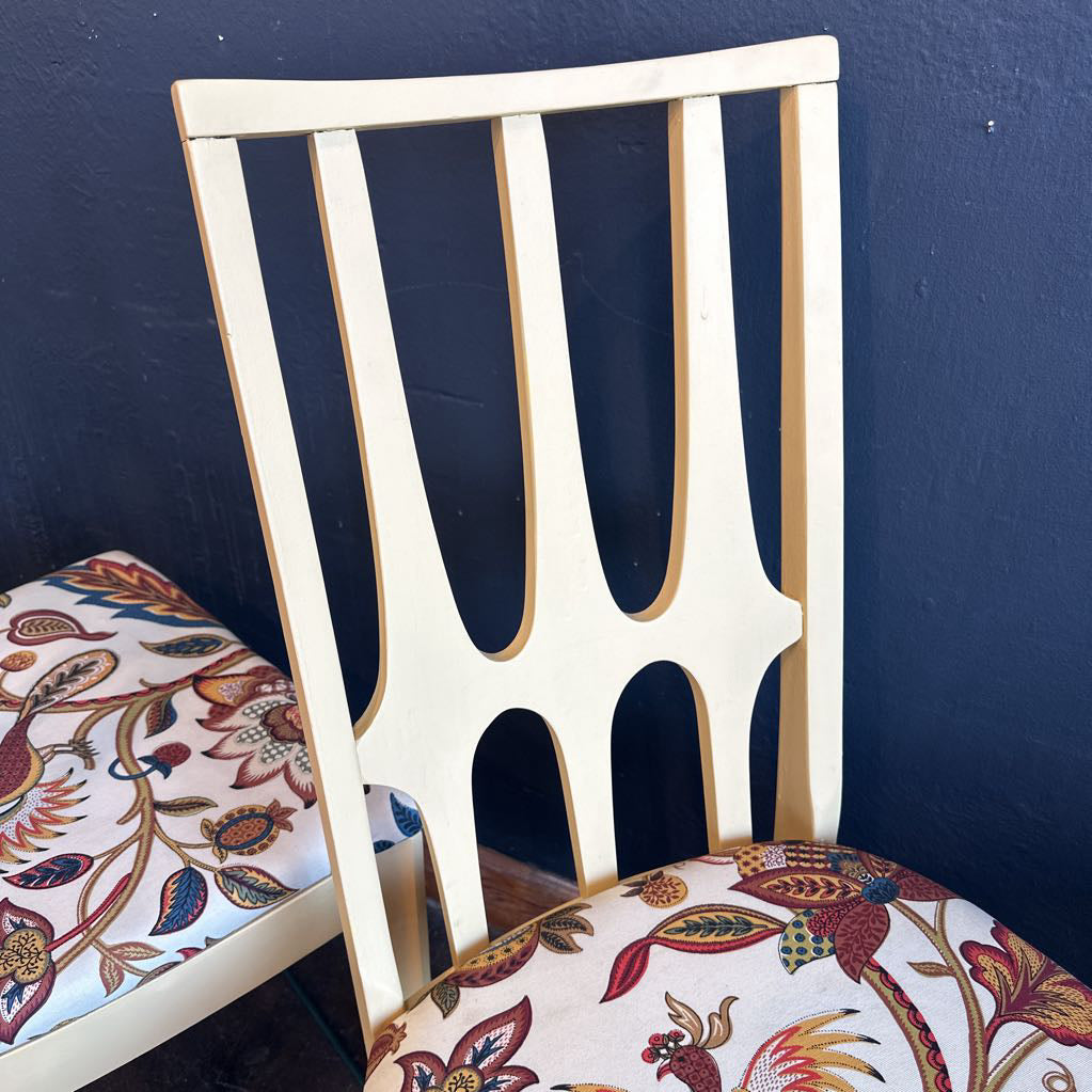 Chair with patterned seat and backrest against a dark blue wall