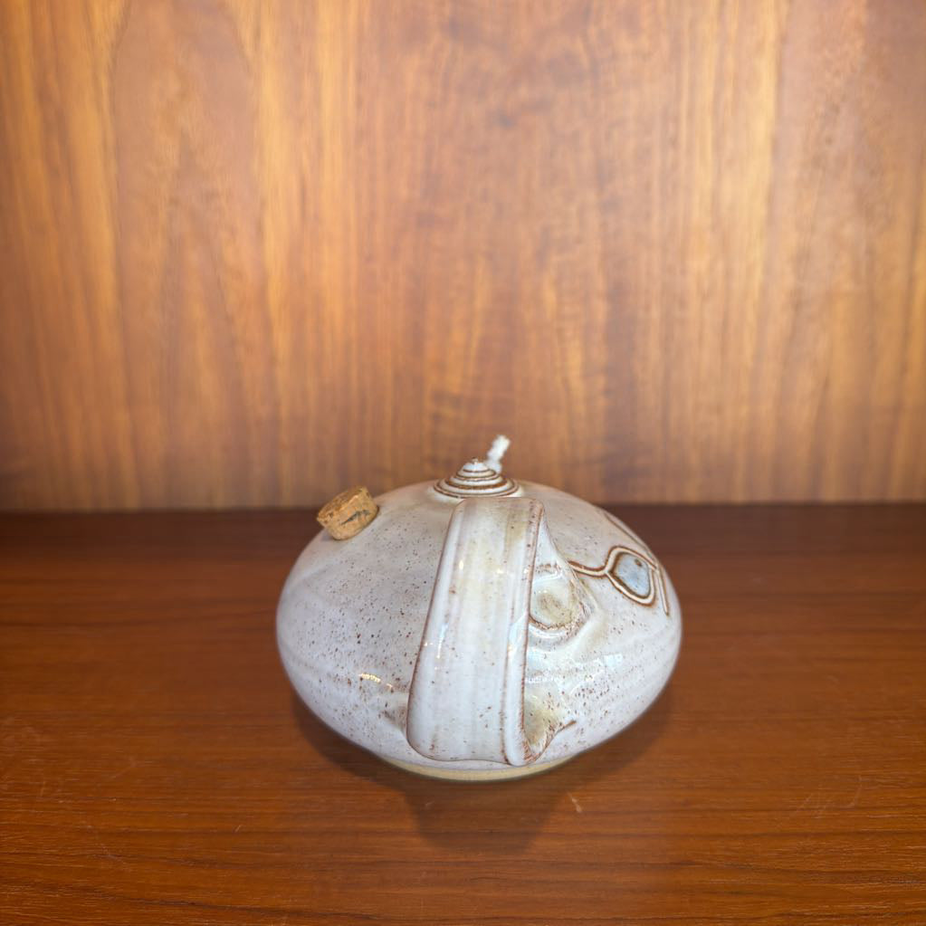 Ceramic vase with decorative patterns on a wooden surface