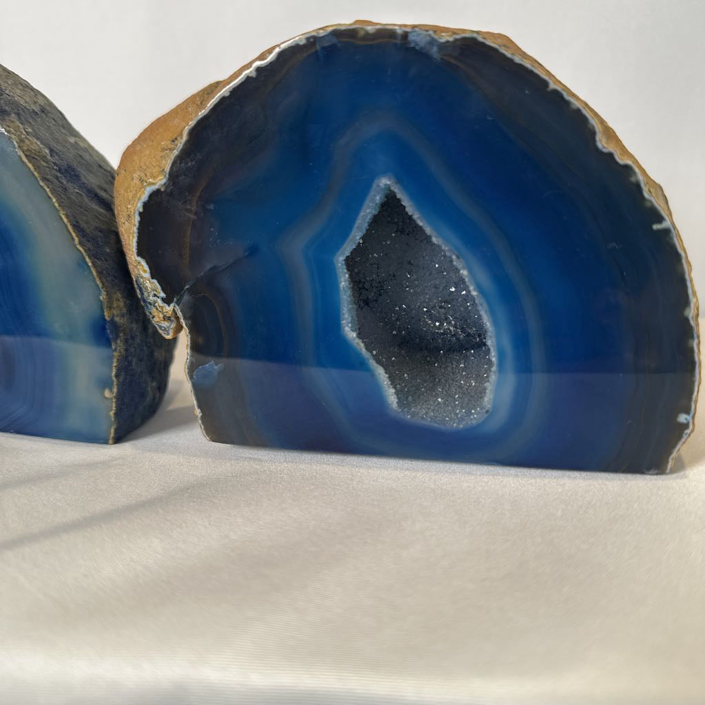 Blue agate stone with a clear center on a white background