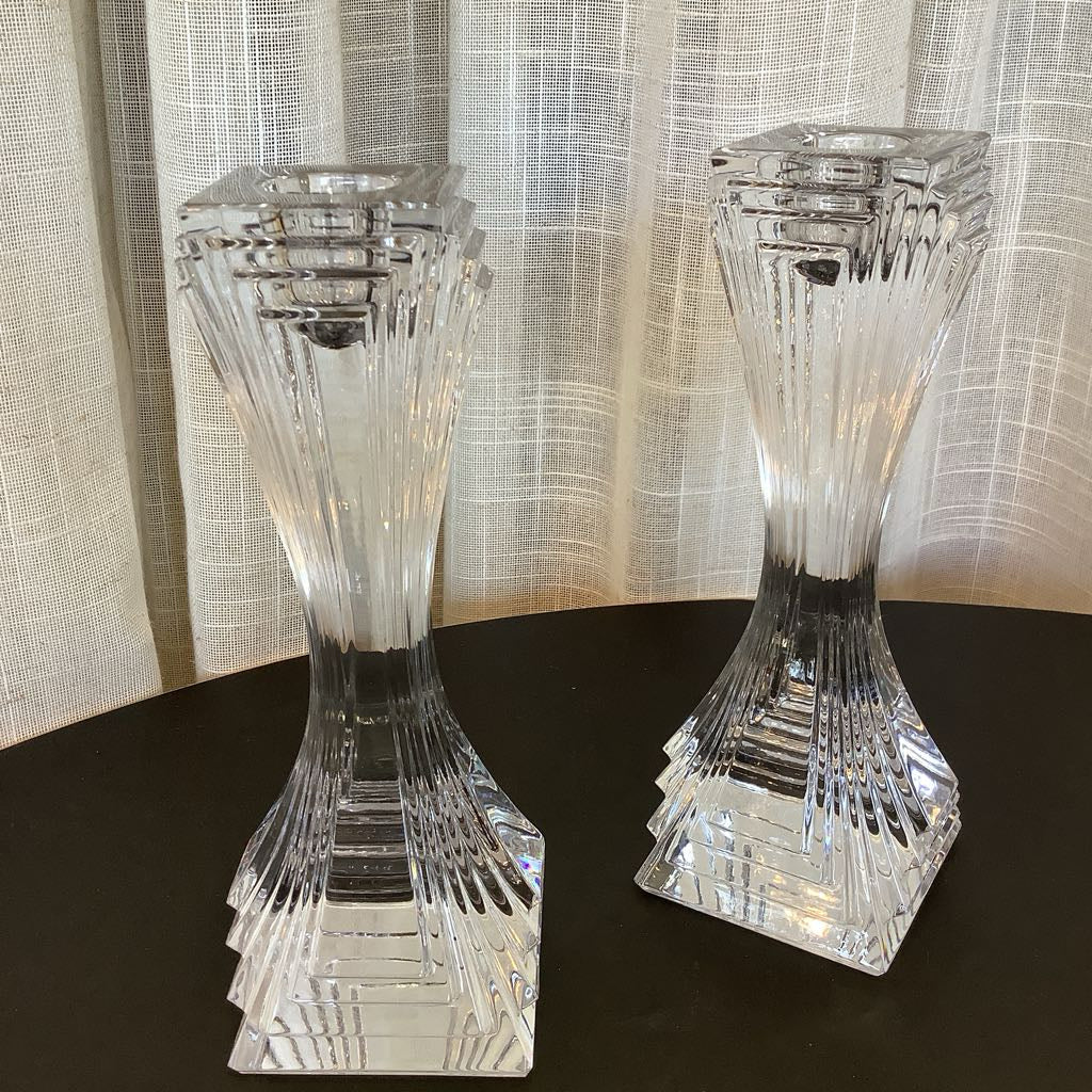 Crystal candle sticks against a neutral background.