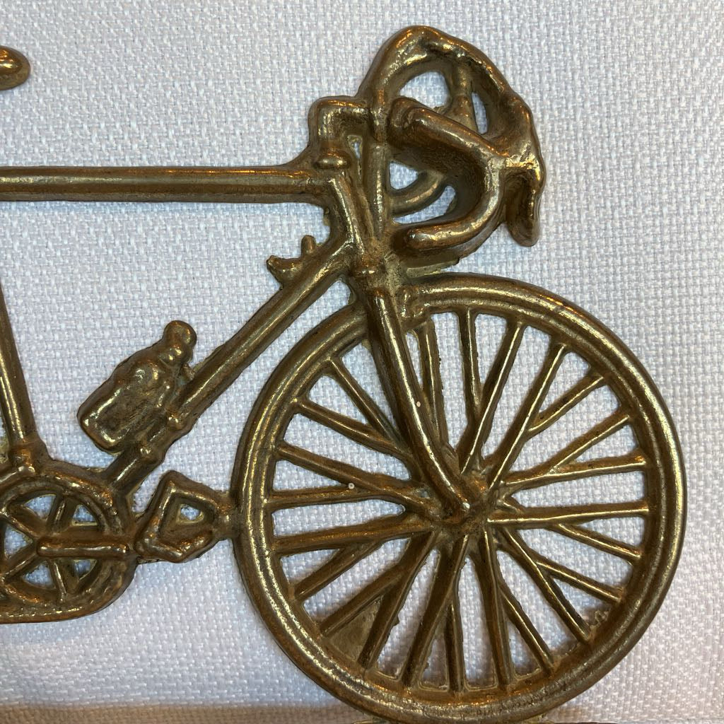 Bronze bicycle ornament on a white background