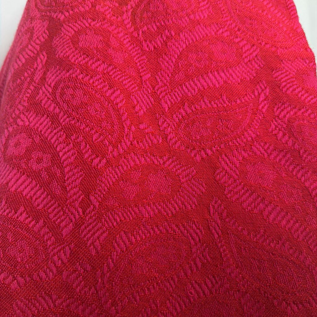 Close-up of red fabric with a pattern