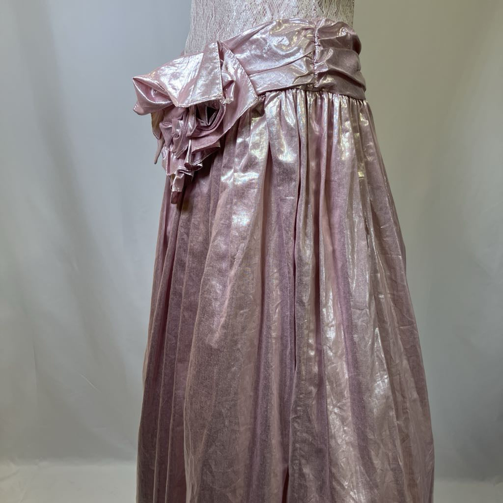 Pink metallic dress with ruffled details on a plain background