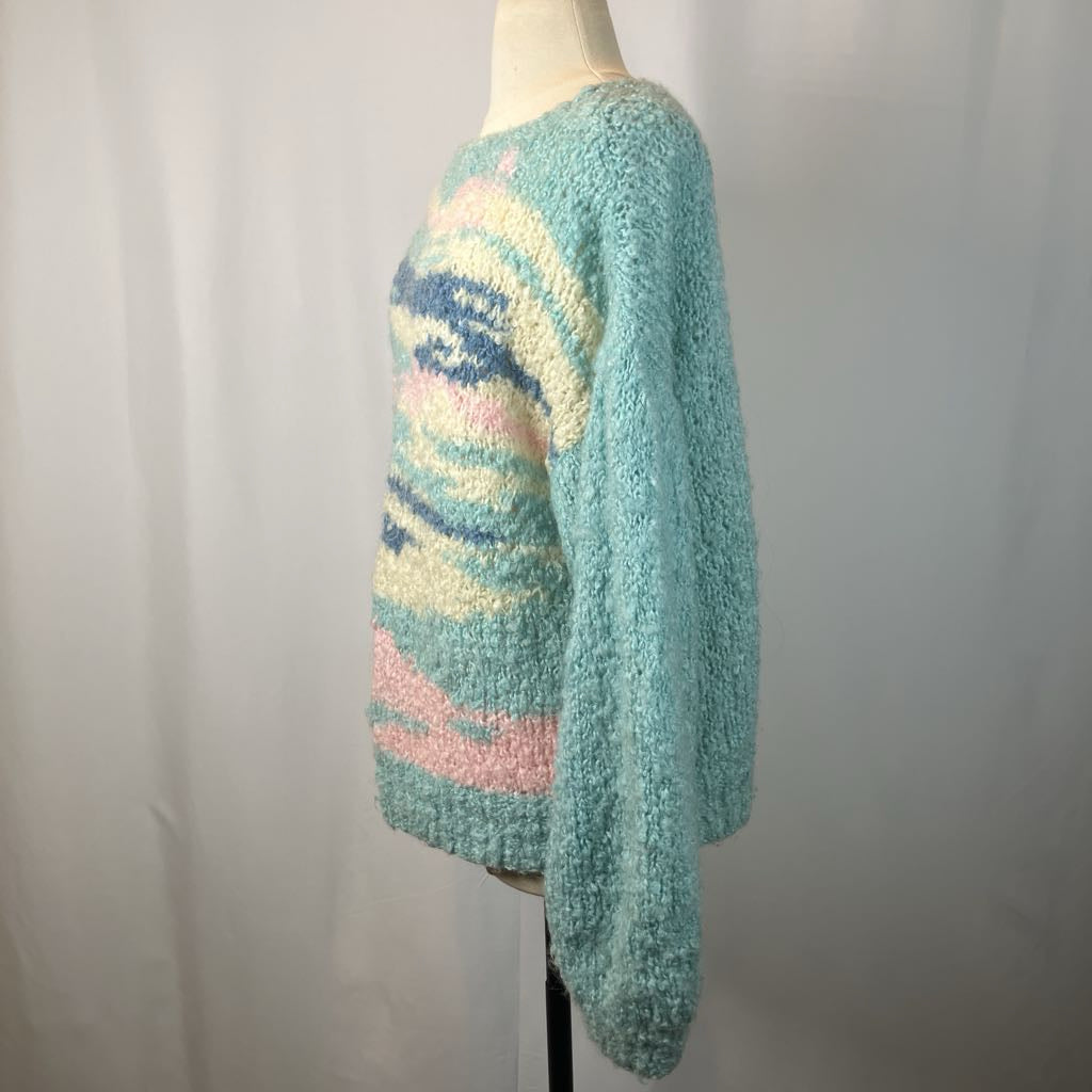 Pastel striped sweater on a mannequin against a plain background