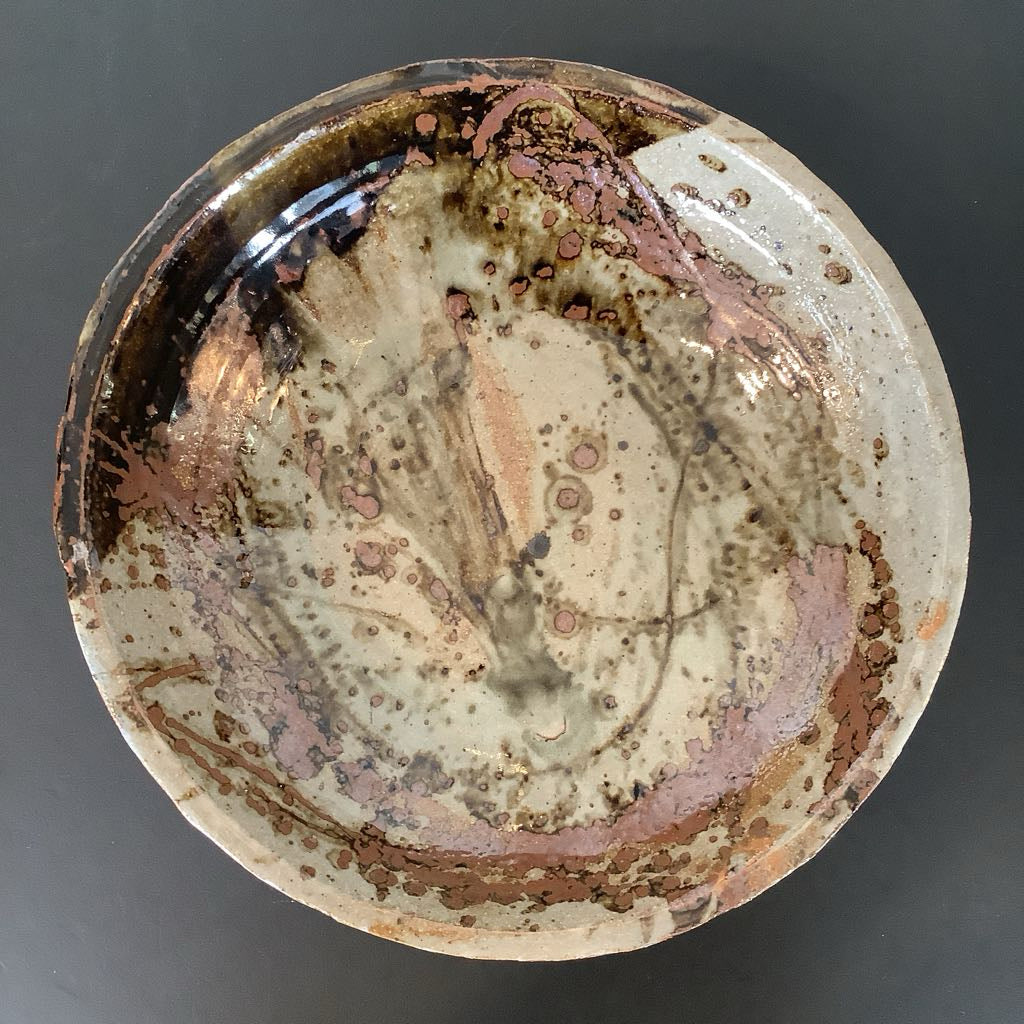 View of pottery bowl with abstract glazed design 